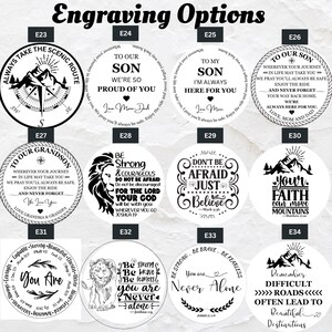 May include: A collection of engraved round pendants with various inspirational messages and designs. The designs include mountain scenes, compasses, and text such as "To Our Son," "Don't Be Afraid," and "You Are." The pendants are for engraving.