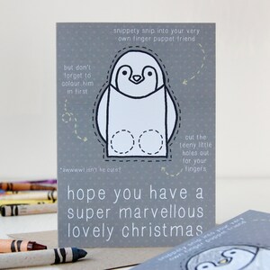 Carte de Noël de marionnette de doigt de pingouin