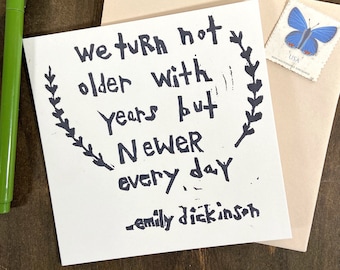 we turn not older with years but newer every day - note card - hand printed - blank inside