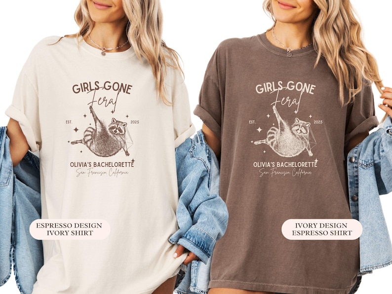 May include: Two t-shirts, one cream and one brown, display a raccoon graphic with the words "GIRLS GONE FERAL" and "OLIVIA'S BACHELORETTE San Francisco California". The design includes the year 2025 and stars.