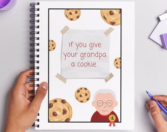 May include: A white notebook with a spiral binding. The cover features a cartoon illustration of a grandpa with a cookie and the text "if you give your grandpa a cookie".