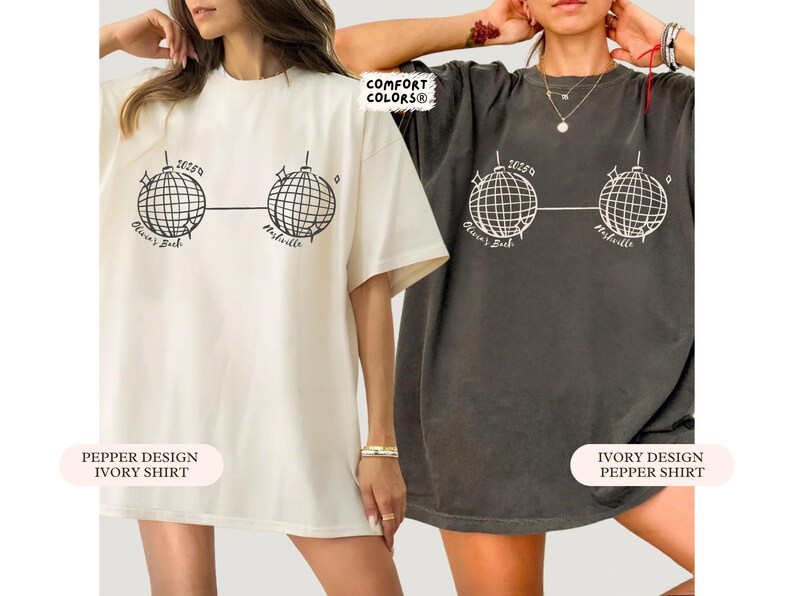 May include: Two oversized t-shirts, one ivory and one pepper, with a graphic of two disco balls linked by a line. The text "2625a", "Olivia's Bach", and "Nashville" are printed on the shirts. The shirts are part of the Comfort Colors collection.