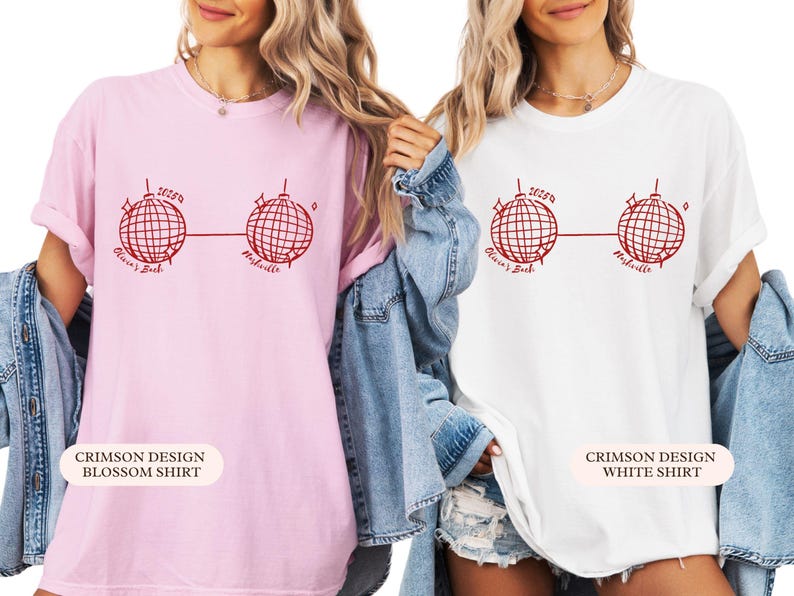 May include: Two t-shirts, one pink and one white, with a red disco ball graphic. Text reads "2025", "Olivia's Bach", and "Nashville". The pink shirt is labelled "Crimson Design Blossom Shirt", and the white shirt is labelled "Crimson Design White Shirt".