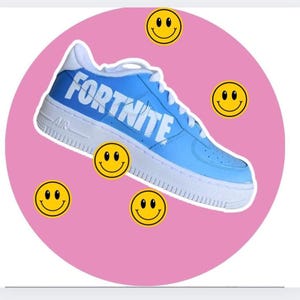 May include: A pair of blue sneakers with the word "FORTNITE" written in white on the side. The sneakers are surrounded by yellow smiley faces on a pink background.
