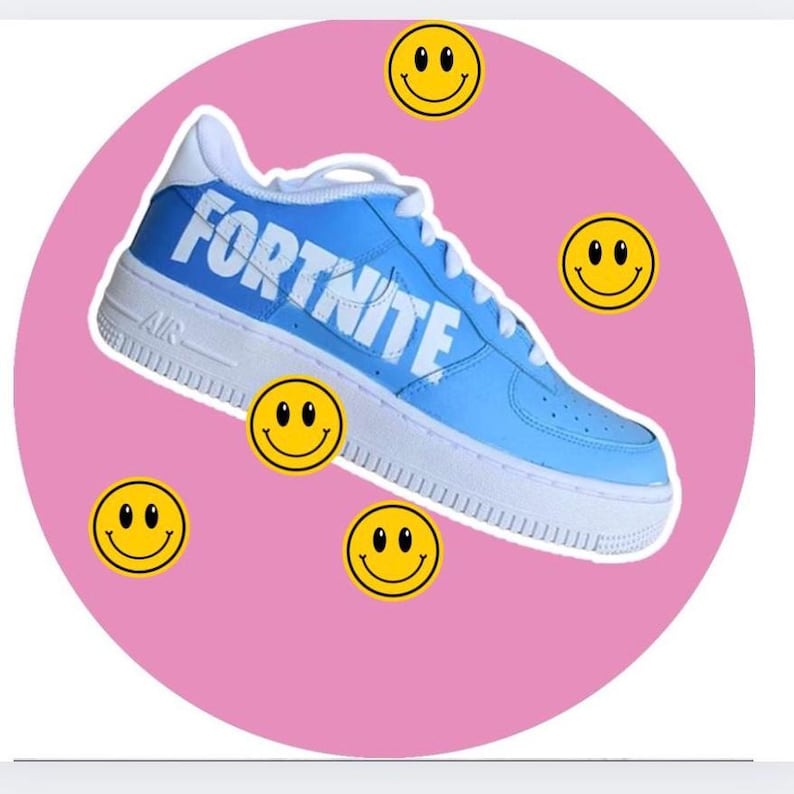 May include: A pair of blue sneakers with the word "FORTNITE" written in white on the side. The sneakers are surrounded by yellow smiley faces on a pink background.