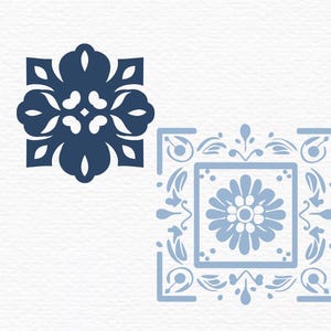 May include: Two blue and white tile designs. The first design is a simple square with four rounded corners and a floral pattern. The second design is a square with a floral border and a larger flower in the center.