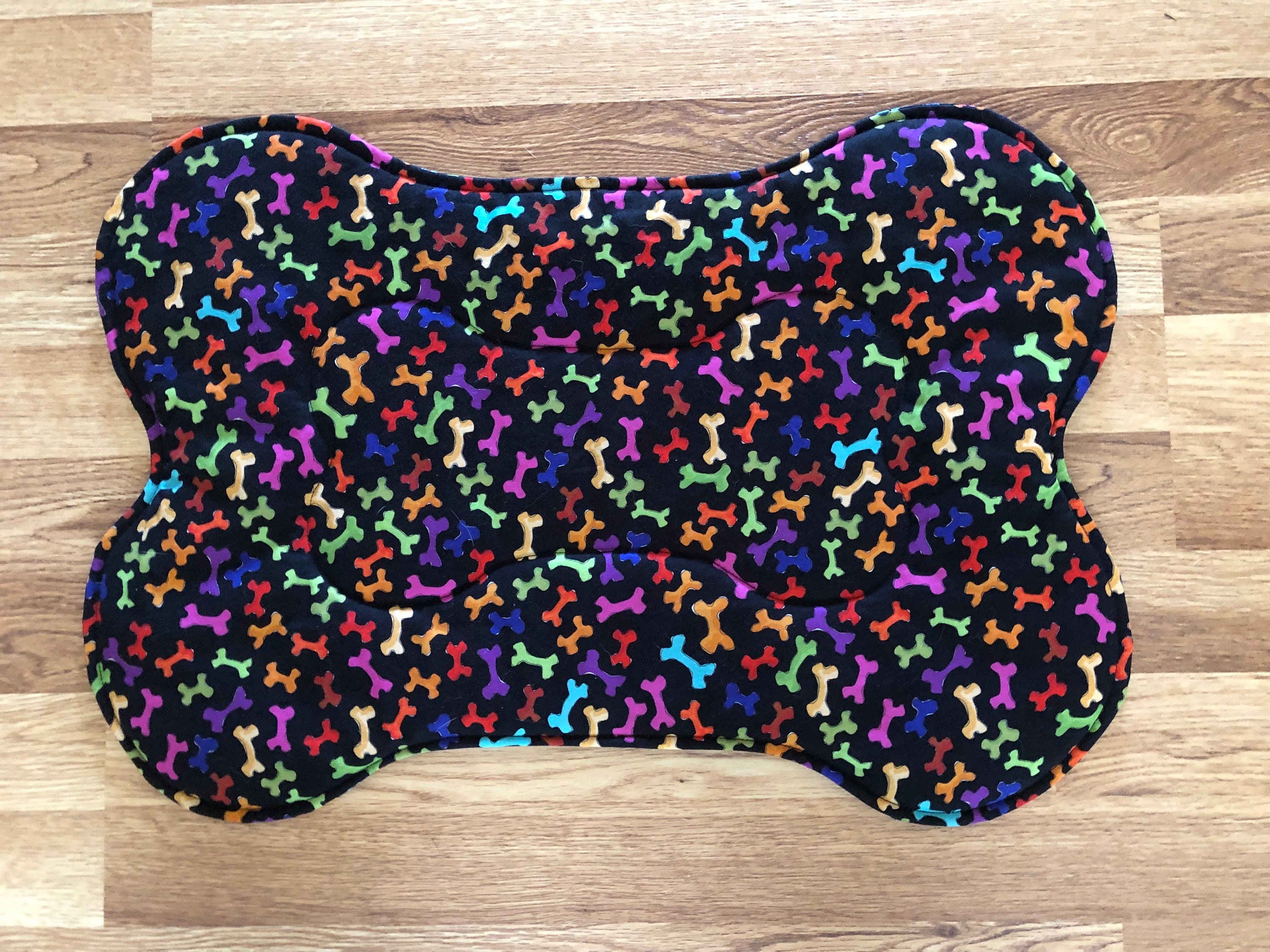 Dog placemats  reversible mats dog bones and paw prints in colors on black