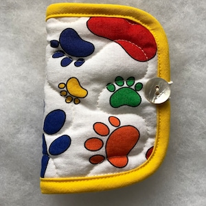 Quilted needle book case organizer - color paw prints on white