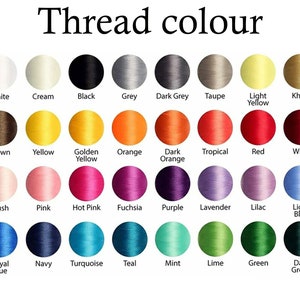May include: A color chart displaying a variety of thread colors. The image shows a grid of thread samples in shades like white, black, grey, yellow, orange, red, blue, green, and purple. The text "Thread colour" is at the top.