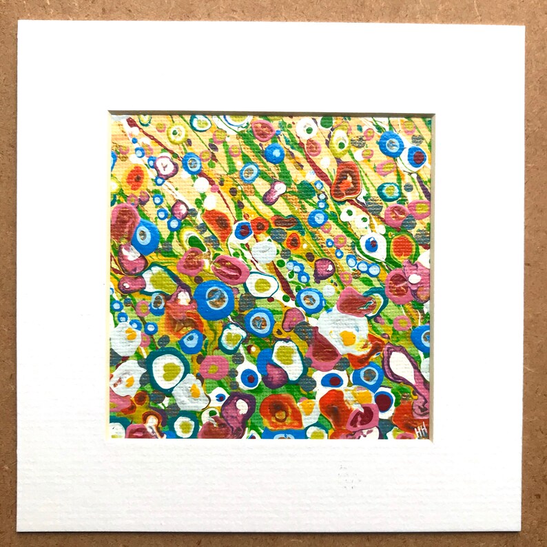 May include: Abstract painting with a colorful, swirling pattern of blue, green, yellow, red, orange, white, and pink. The painting has a textured, organic feel.