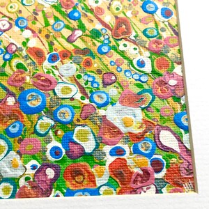 May include: Abstract painting with a colorful, textured background. The painting features a variety of shapes and colors, including blue, green, yellow, red, and white. The paint is applied in a thick, textured layer, creating a three-dimensional effect.