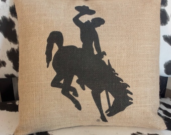 Cowboy and bucking horse burlap throw pillow - black Wyoming steamboat logo, WYO state pride pillow