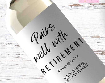 May include: White wine bottle with a label that says "Pairs well with RETIREMENT" and "Congratulations! Love, Tina and Dave".