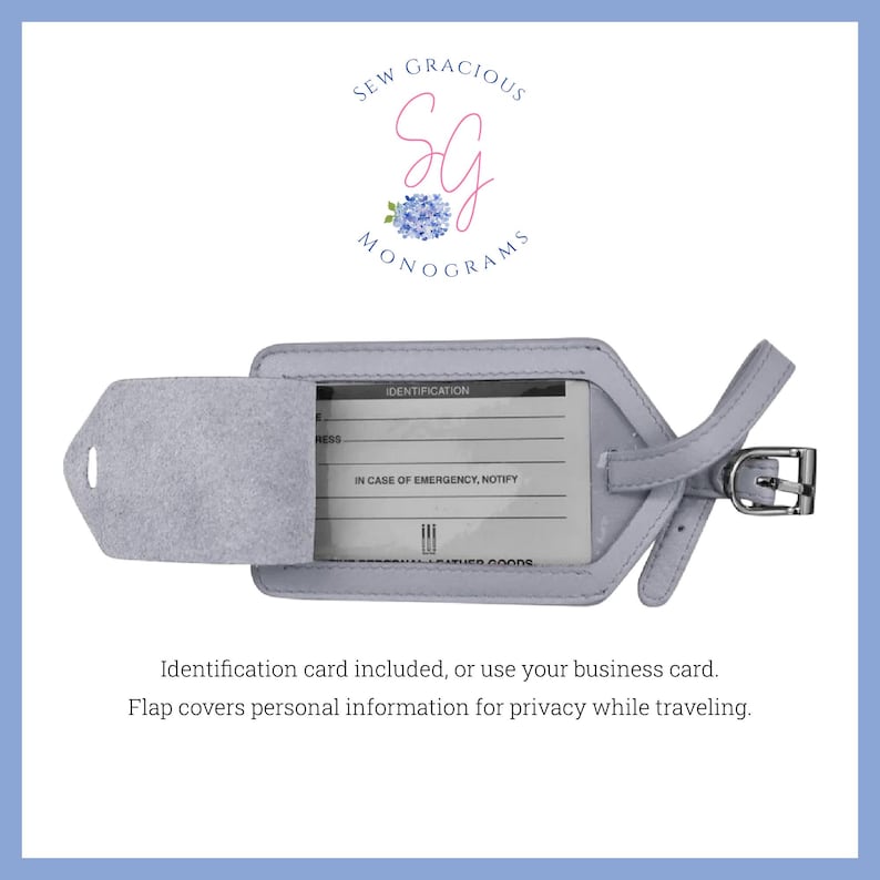 May include: A light grey leather luggage tag with a flap that covers a clear plastic window. The window has a form for identification and emergency contact information. The tag has a strap and a metal buckle.