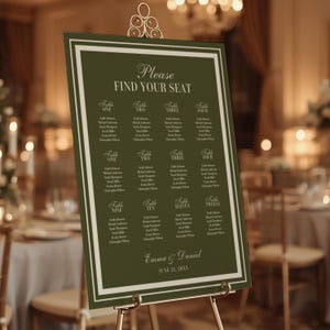 May include: A dark green wedding seating plan with a white border, displayed on a gold easel. The chart reads "Please Find Your Seat" and lists table numbers and guest names. The names "Emma & Daniel" and the date "June 21, 20XX" are also displayed.