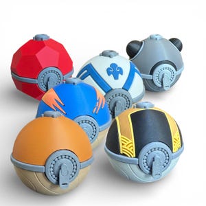 May include: A collection of six colorful, spherical objects with a button-like mechanism. The objects are in various colors, including red, blue, orange, gray, and yellow, with detailed designs. The objects appear to be 3D-printed.