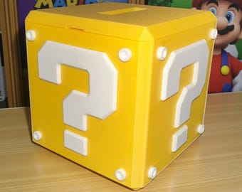 Hucha con forma de pregunta de Mario impresa en 3D: decoración para gamers geeks
