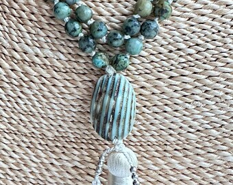 Faceted African Turquoise Hand-Knotted Beaded Necklace Featuring A Turbo Shell Focal