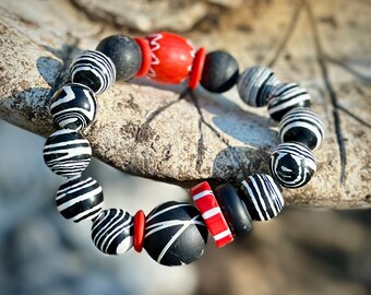 Unique Tribal Style Artisan Crafted Beaded Bracelet in Classic Black and White with Pops of Red Colors