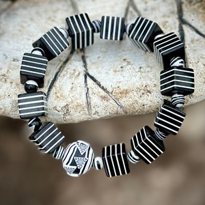 Whether you're a fan of Beetlejuice, an admirer of Art Deco aesthetics, or simply someone who appreciates unique and handcrafted jewelry, this bracelet is sure to make a statement wherever you go.