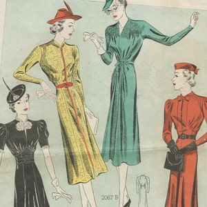 May include: Three women wearing different vintage dresses and hats. The woman on the left is wearing a black dress with a white flower on the collar. The woman in the center is wearing a yellow dress with a red belt and a red hat. The woman on the right is wearing a red dress with a red bow and a red hat. The image includes the text "2067 B".