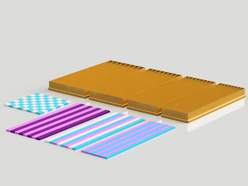 May include: A set of four gold-colored metal trays with a checkered pattern, a purple and white striped pattern, a blue and white striped pattern, and a pink and white striped pattern.