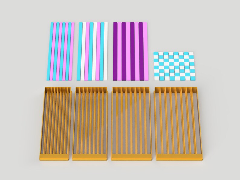 May include: Four gold cookie cutters with a vertical line pattern and one cookie cutter with a checkered pattern. The cookie cutters are arranged in a row on a white surface. The cookie cutters are for making striped and checkered cookies.