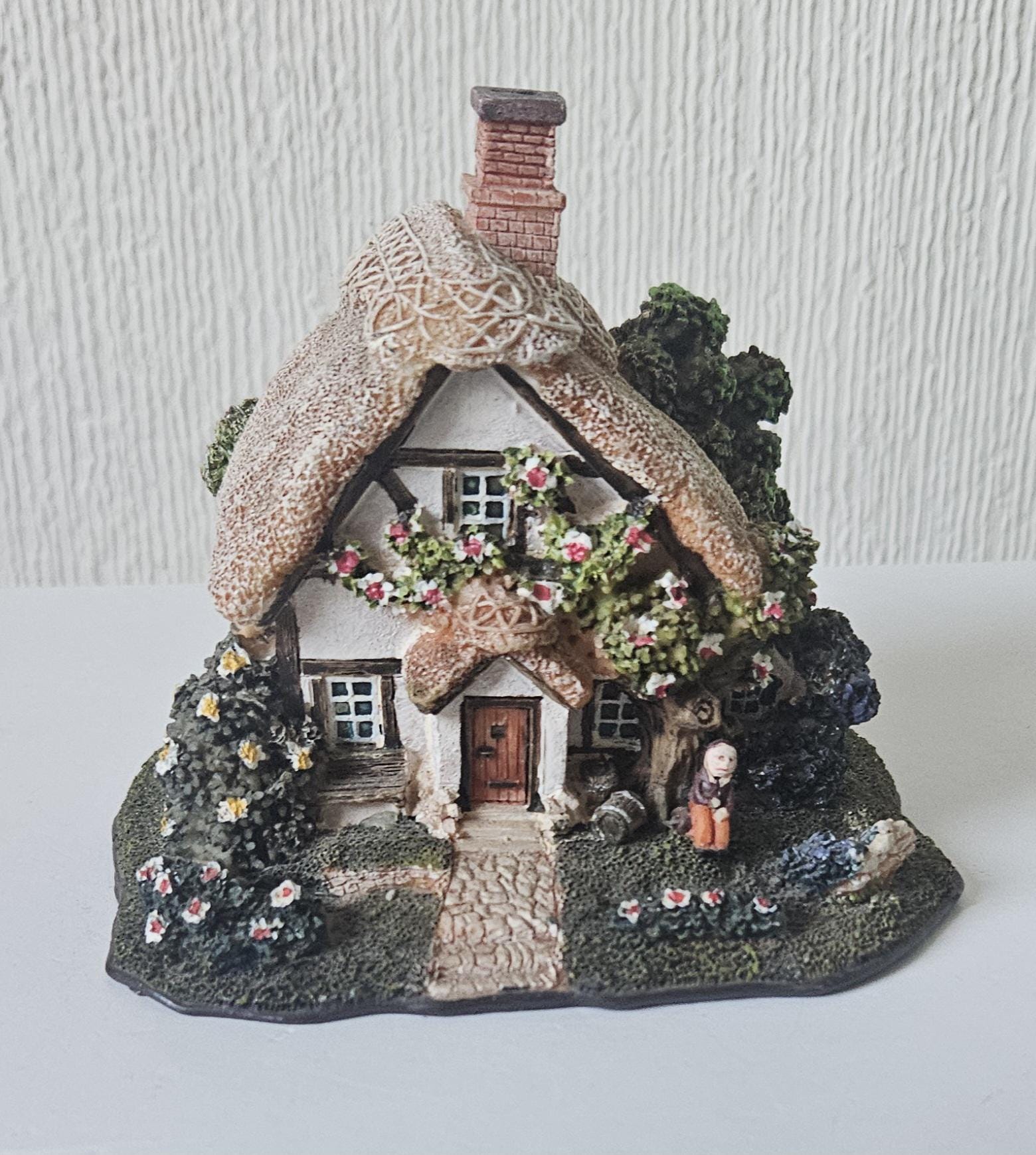 vintage-resin-small-cottage-ornament-with-thatched-roof-and-person-etsy