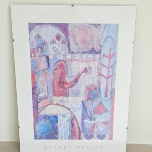 May include: Abstract art print featuring a bird-like figure in shades of red, pink, and blue. The artwork, titled "Annora Spence," is framed and mounted, showcasing a blend of geometric and organic shapes.