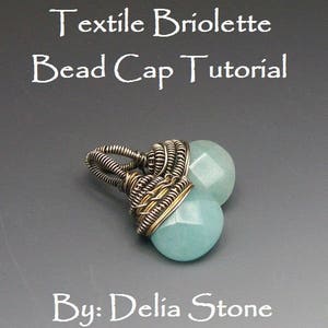 May include: A close-up of a turquoise gemstone bead cap tutorial. The bead cap is made with silver and gold wire wrapped around a turquoise gemstone. The text "Textile Briolette Bead Cap Tutorial" and "By: Delia Stone" is visible in the image.