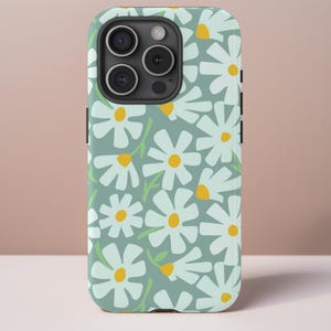 May include: A light blue phone case with a white daisy pattern. The case has a cutout for the camera lens.
