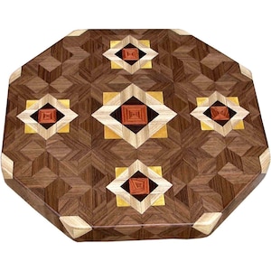 May include: Octagonal wooden cutting board with a geometric pattern of inlaid wood in shades of brown, gold, and red.