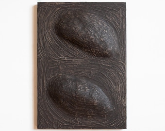 Black Wabi Sabi Art. Dimensional wall sculpture made of paper mache and plaster in soft dark color. Organic modern art. Abstract painting.