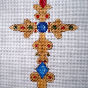 May include: A gold cross with intricate details and blue, red, and green gemstones. The cross is a religious symbol and would be a beautiful addition to any home.