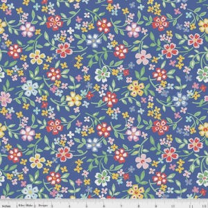 May include: A blue fabric with a floral pattern. The design features red, pink, yellow, and white flowers with green vines and leaves. The fabric is marked with inches.