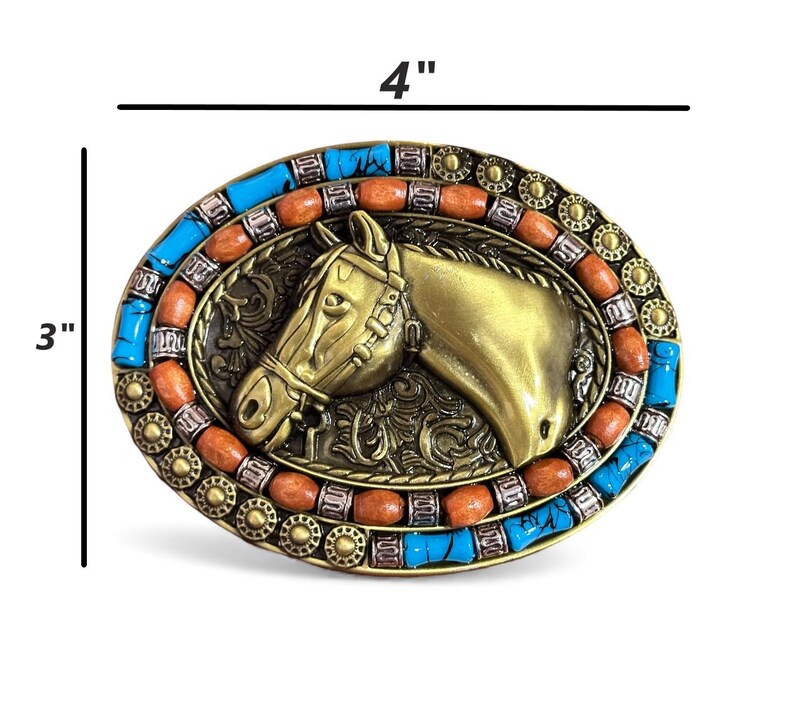 May include: Oval belt buckle, 10 cm wide and 7.6 cm tall, with a brass horse head design. The buckle is decorated with turquoise and orange stones around the edge, creating a decorative western style.