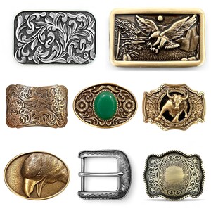 May include: A collection of decorative belt buckles in various shapes and designs. The buckles feature intricate patterns, including floral, eagle, and bull motifs. Colors include silver, gold, and bronze.
