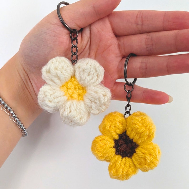two handmade crochet puffy flower keychains, bag charms, purse accessories, sunflower and daisy