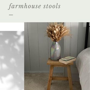 May include: A small, handmade rustic farmhouse stool made of light wood. A vase with dried flowers and a book sit on the stool. The text reads "Highland woodworker" and "Handmade Rustic farmhouse stools". The phrase "Treat yourself today" is also visible.
