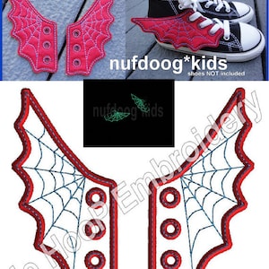 May include: Red spider web shoe wings with a black web design. The wings are designed to be attached to shoes. The text "nufdoog*kids" is visible in the image.