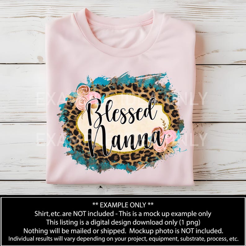 May include: A pink t-shirt with a design featuring a leopard print, turquoise paint splatter, and a gold oval with the text "Blessed Nanna" in a white font.