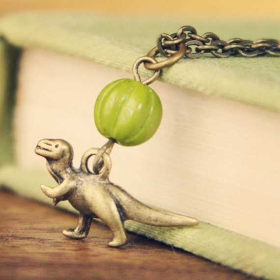 Items similar to t-rex dino necklace on Etsy