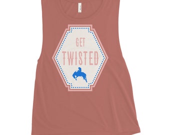 May include: A rust-colored sleeveless muscle tank top with a white hexagon graphic. The graphic has a pink outline and blue polka dots. The text "GET TWISTED" is in white with a blue silhouette of a person riding a horse.