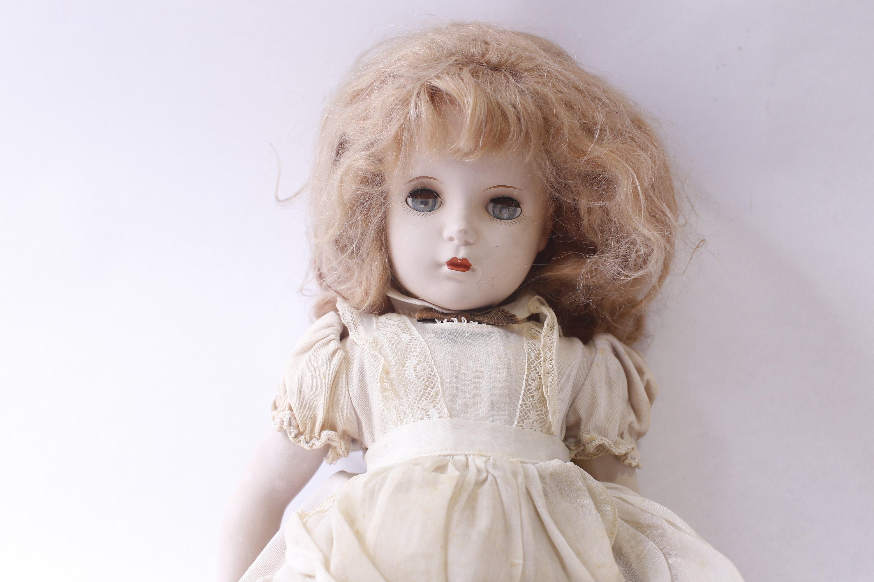 Antique Porcelain Bisque Girl Doll in White-blue Dress With Apron