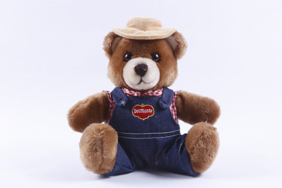 茶色いクマのぬいぐるみ 青い帽子付き 茶色いクマのぬいぐるみ 青い帽子付き デルモンテ、着衣、クマ