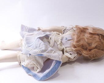 Antique Porcelain Bisque Girl Doll in White-blue Dress With Apron