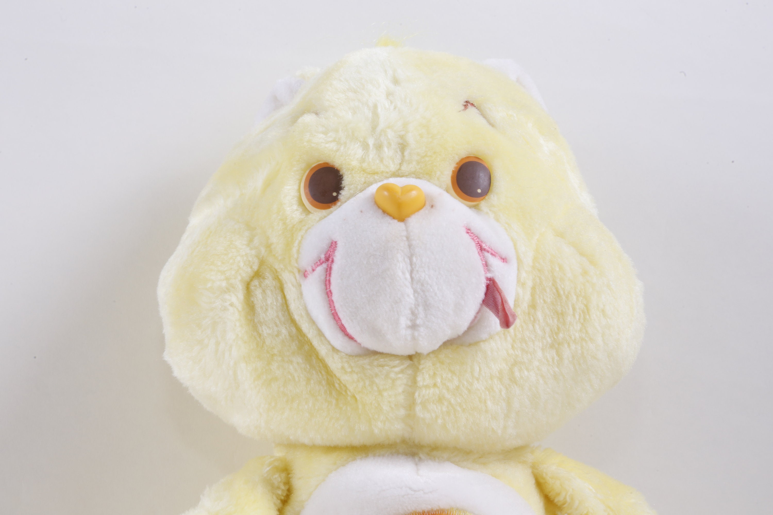 yellow care bear plush