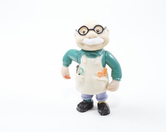 Figura de juguete de plástico vintage Teddy Ruxpin Newton Gimmick con gafas, herramientas y delantal. Juguetes vintage para niños, ~ 20-01-96