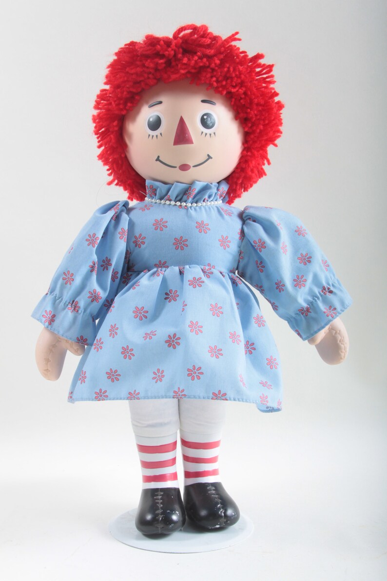 black raggedy ann doll with red hair