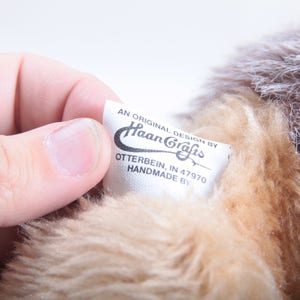 May include: A white tag with black text that reads "An original design by Haan Crafts, Otterbein, IN 47970 Handmade by".